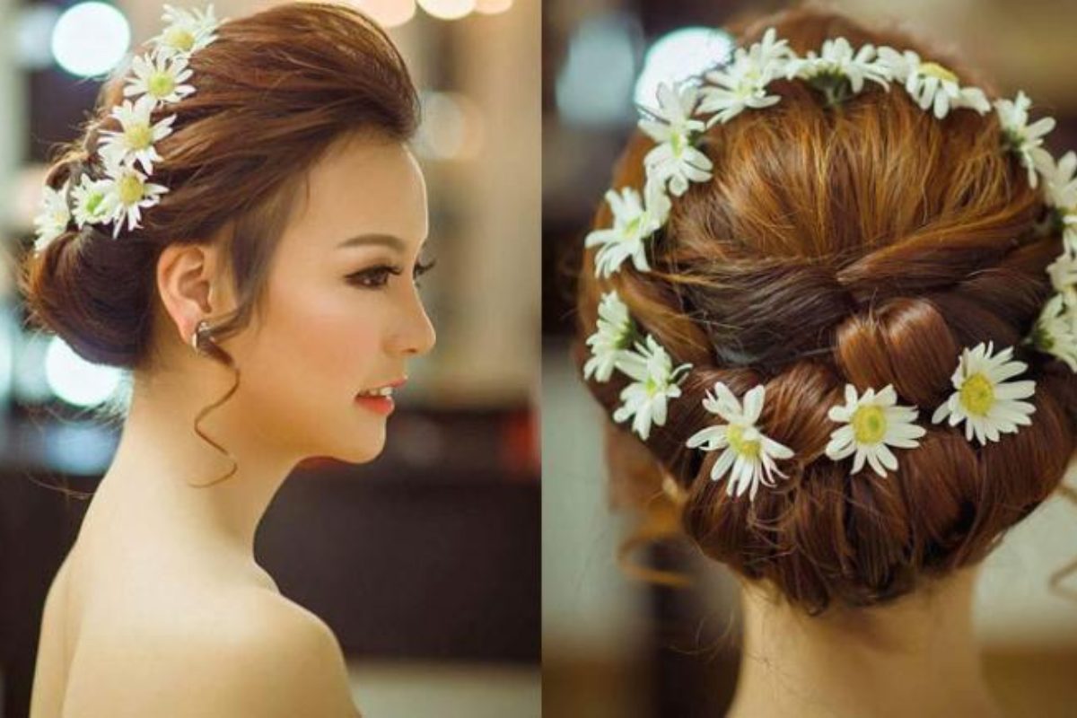 Mái tóc cô dâu điểm xuyết hoa cúc họa mi trắng tạo nét mộc mạc, dịu dàng. (Ảnh: Sưu tầm)